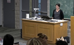 Dr. Melanie Greene stands in front of a classroom facilitating a session.